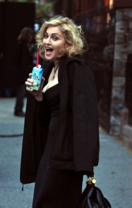 Madonna drinking a coconut water on the street