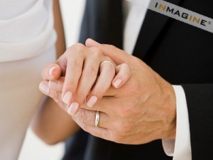 Close-up on a bride and groom's hands