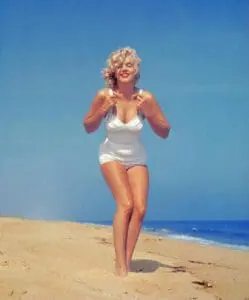 Ultimate Swimsuit Dilemma: The Real Deal Behind Swimsuit Fat Bulges 3 Marilyn Monroe in a white swimsuit at the beach