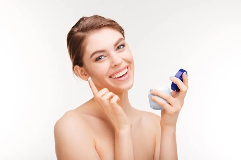 Woman Having Fun While Applying Skin Cream