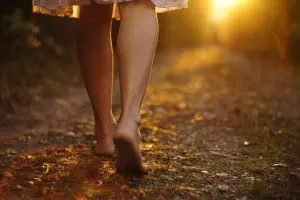 Legs without Spider Veins Strolling Down an Autumnal Path