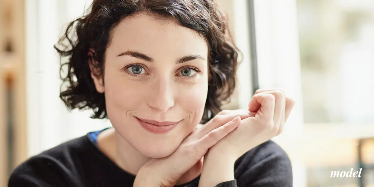 Woman Resting Her Face on Her Hands
