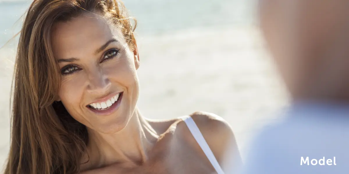 Woman Smiling at the Beach